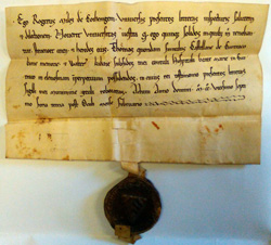 Akte uit 1228 waarin ridder Rogier van Kooigem een rente schenkt aan het hospitaal (Inventaris van het archief van het Onze-Lieve-Vrouwehospitaal te Kortrijk (1211-1939), nr. 246).